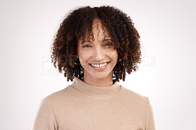 Buy stock photo Cropped portrait of an attractive young woman posing in studio against a grey background