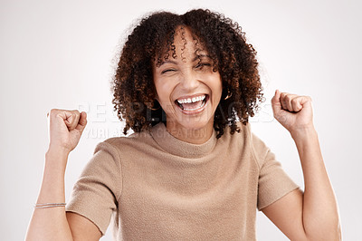 Buy stock photo Cropped portrait of an attractive young woman cheering in studio against a pink background