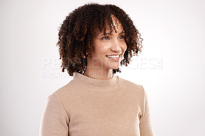 Buy stock photo Cropped shot of an attractive young woman looking thoughtful in studio against a grey background