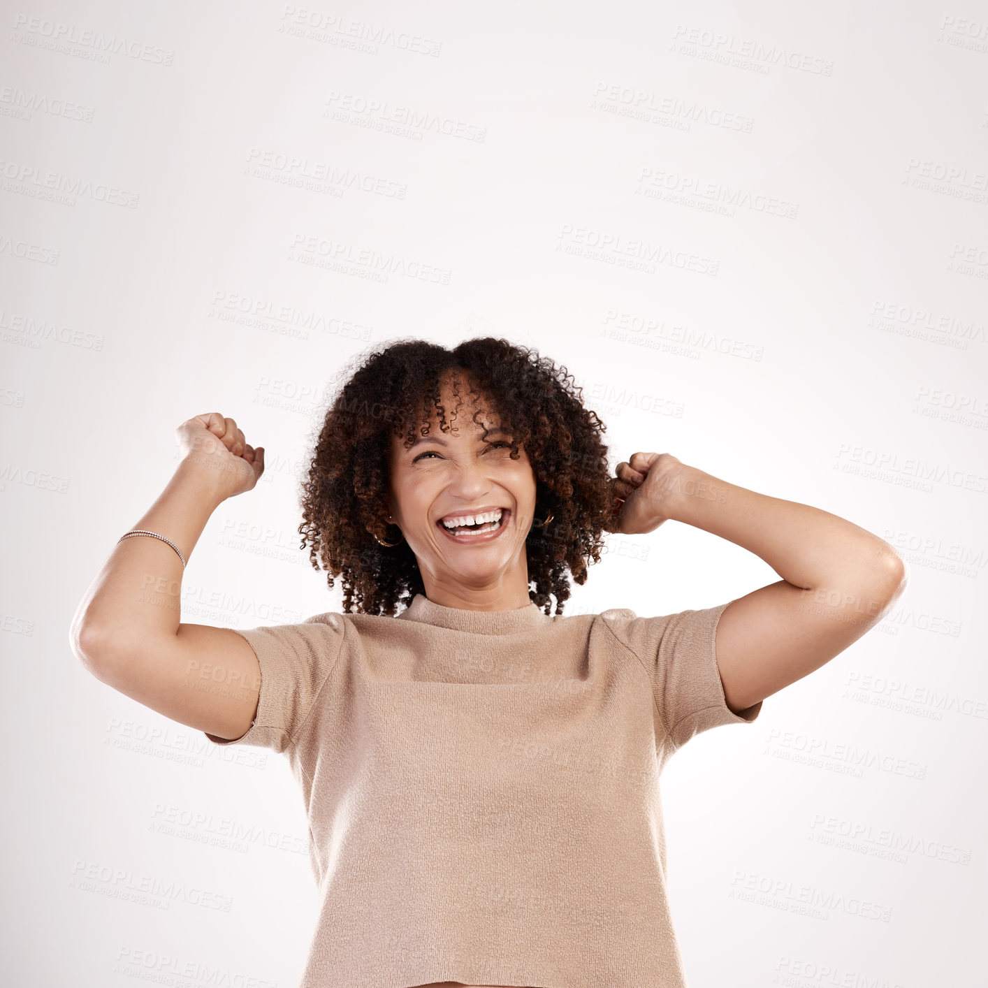 Buy stock photo Cropped shot of an attractive young woman cheering in studio against a grey background