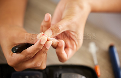 Buy stock photo Finger, diabetes and a person checking their insulin level in a home closeup for routine treatment. Hands, test and medical equipment with a diabetic adult taking a sample to check blood sugar