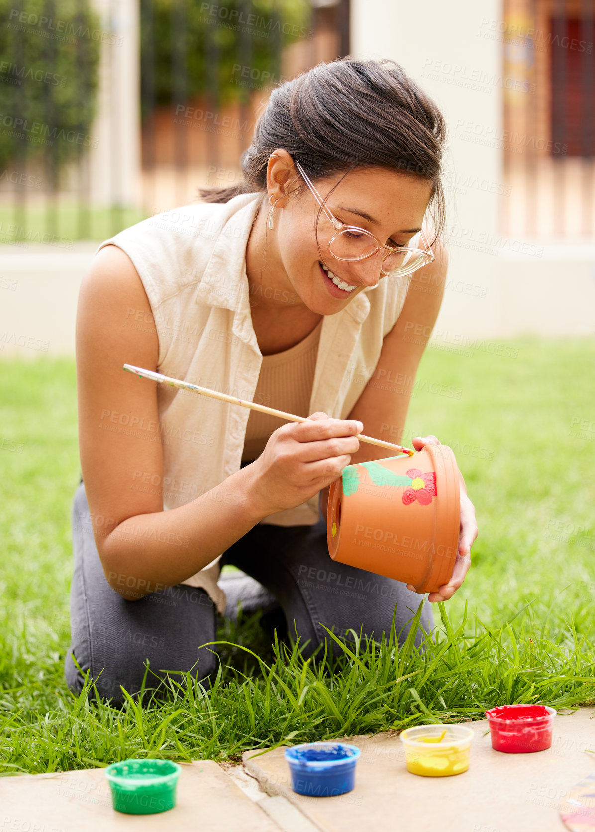 Buy stock photo Ceramic, pot and girl painting a craft container for plant in garden with creativity, happiness or hobby. Clay, art and artist with inspiration outdoor with paint brush, decoration or fun project