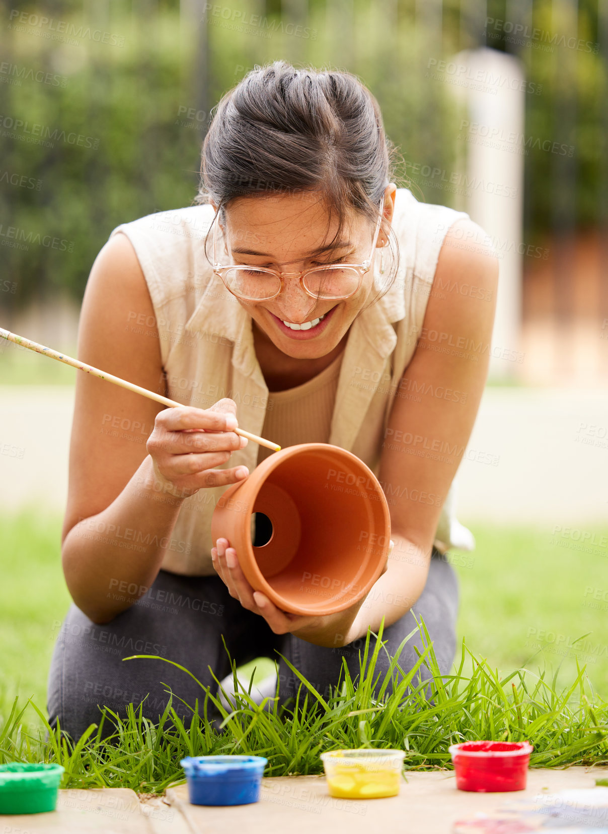 Buy stock photo Clay, pot and girl painting a craft container for plant in garden with creativity in hobby. Ceramic, art and happy artist outdoor with paint brush for fun decoration project for house and gardening