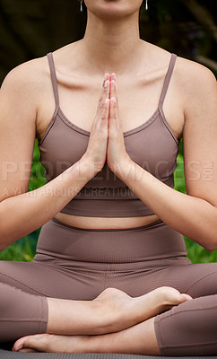 Buy stock photo Closeup shot of an unrecognisable woman meditating outdoors