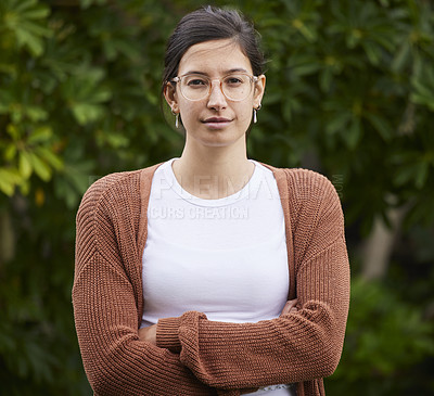 Buy stock photo Woman, portrait and confidence with arms crossed outdoor for relax, pride and casual clothes in park. Person, face and motivated in nature with glasses, calm expression or standing in garden of house