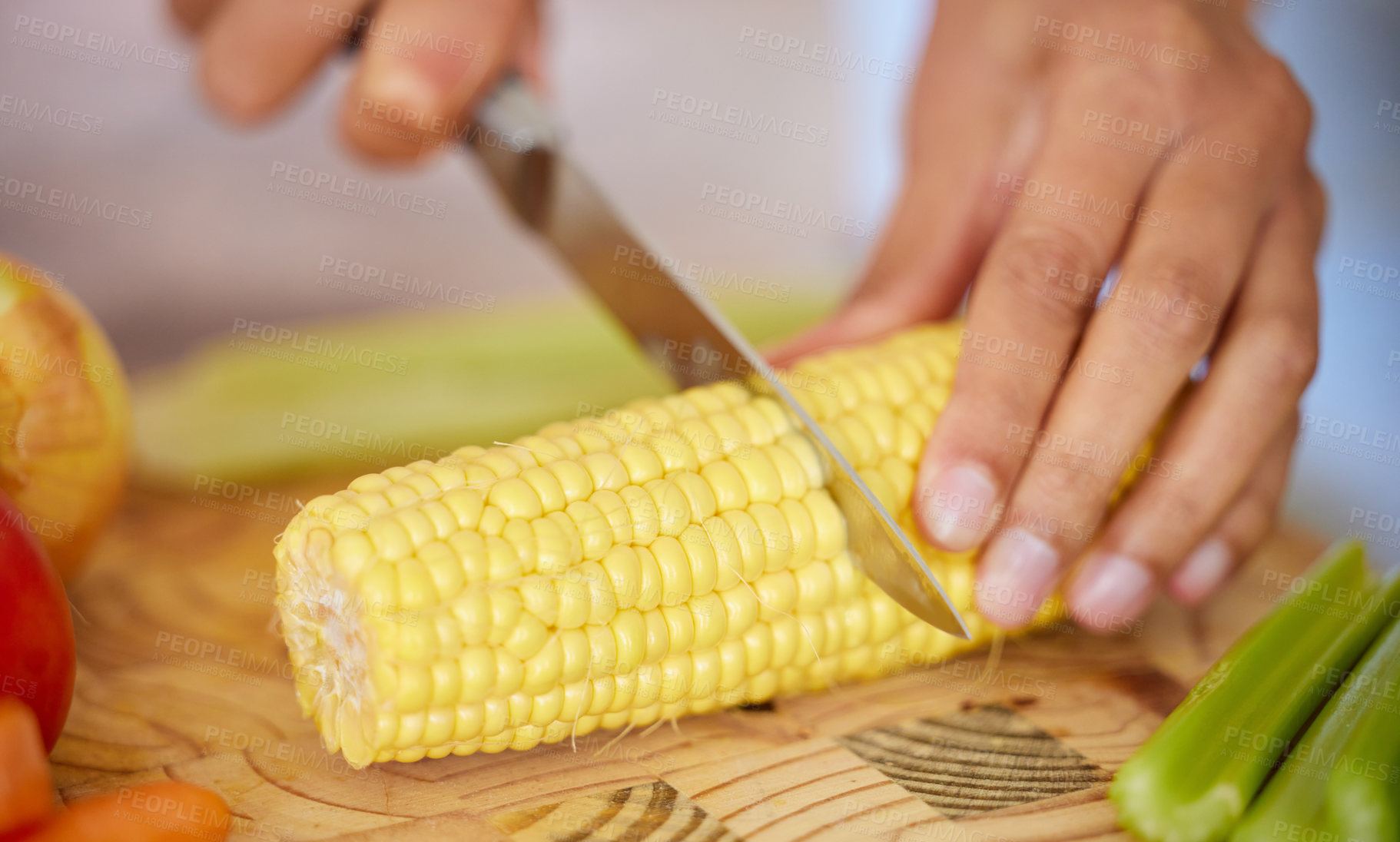 Buy stock photo Food, dinner and hands in a kitchen with diet, nutrition and cooking in a home with chopping board. Eating, healthy and vegetable preparation with vegan, organic and corn meal in a house for wellness