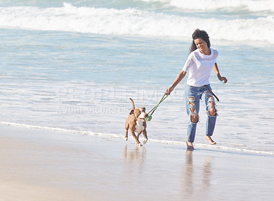 Buy stock photo Beach, woman and dog with running with toys for fun, exercise and healthy energy for happy animal in nature. Ocean, girl and playful pitbull with outdoor training, pet fitness and wellness in morning