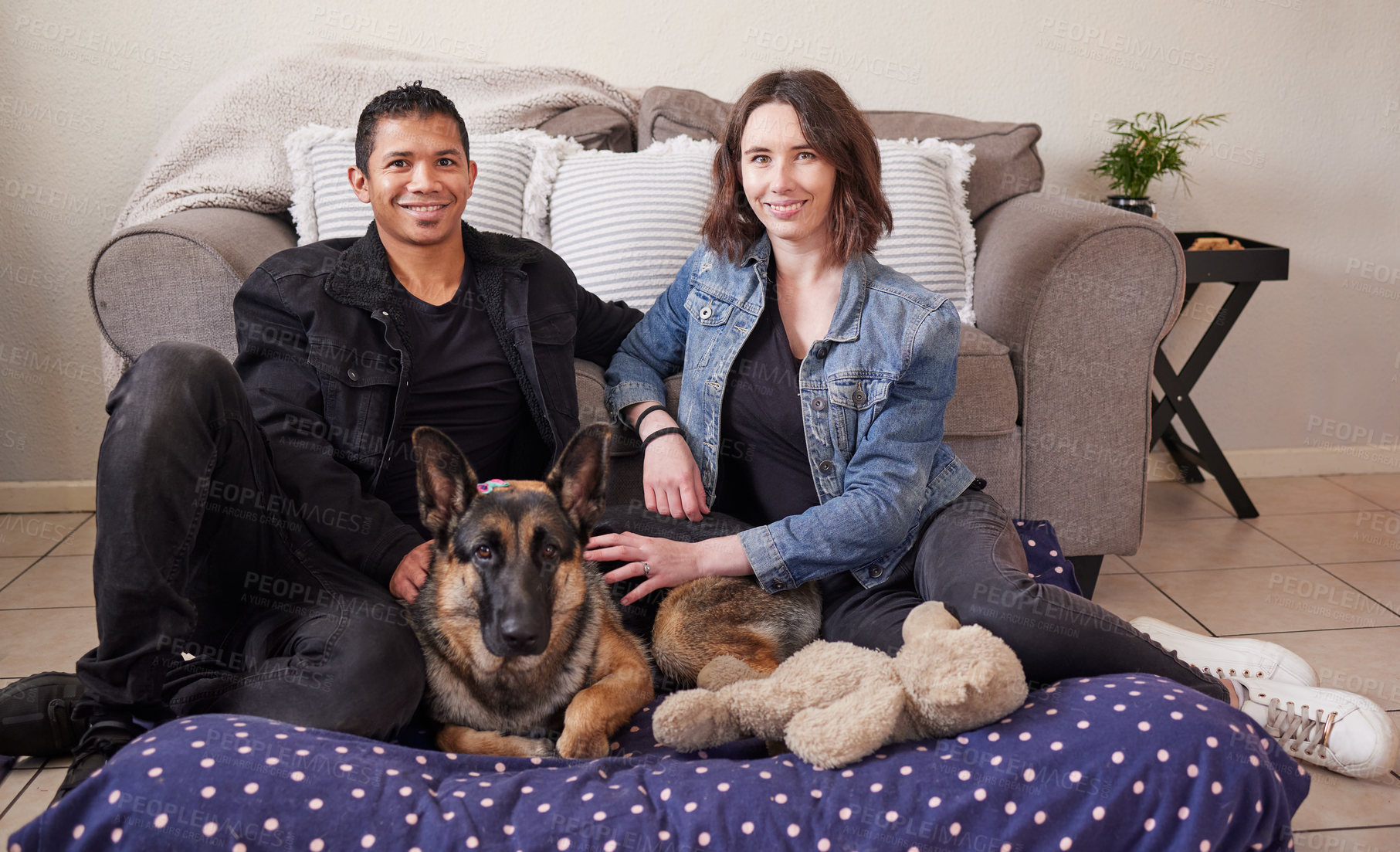 Buy stock photo Interracial couple, living room and portrait with dog in new house with rescue and foster pet with smile. Love, care and lounge with people and animal together with loyalty, trust and bonding at home