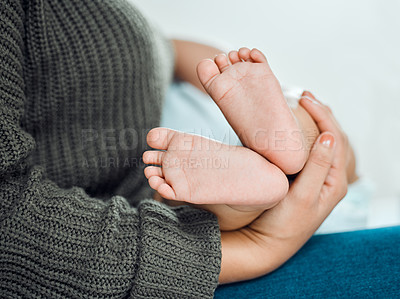 Buy stock photo Closeup shot of a woman holding up her baby's tiny feet
