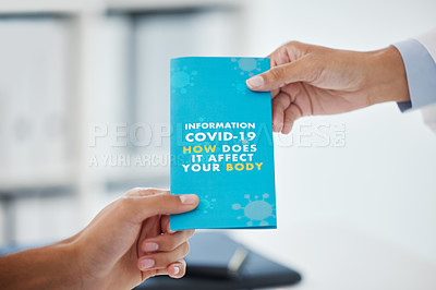 Buy stock photo Cropped shot of an unrecognizable man taking a leaflet from his doctor during a consult in the clinic