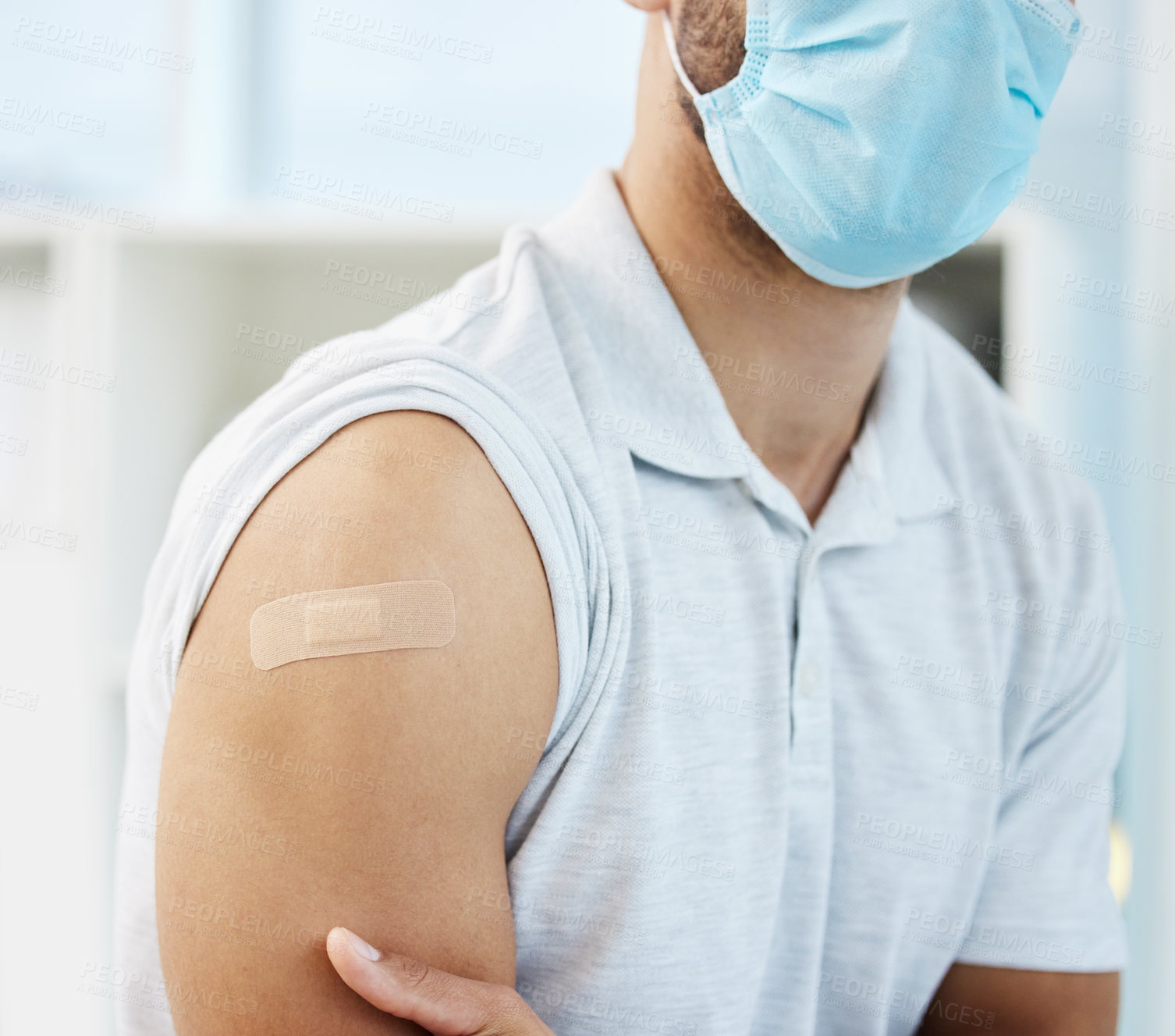 Buy stock photo Man, patient and plaster on arm for injection, healthcare and immunity booster or treatment in clinic. Person, bandage and hospital consultation for vaccine, medicine and band aid for influenza shot