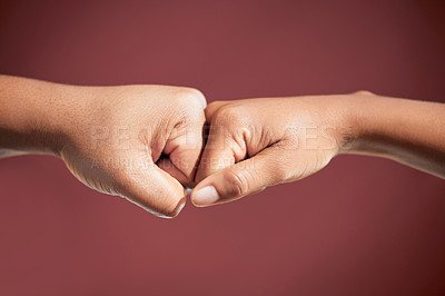 Buy stock photo Fist bump, people and teamwork in studio for agreement, collaboration or deal by red background. Person, partnership and welcome with respect, support or solidarity with trust, link and synergy