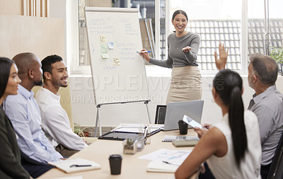 Buy stock photo Cropped shot of an attractive young businesswoman giving a presentation during a meeting in the boardroom