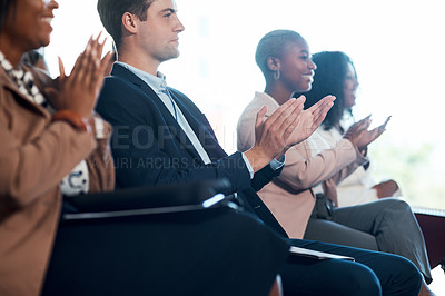 Buy stock photo Shot of a group of young businesspeople clapping during a conference in a modern office