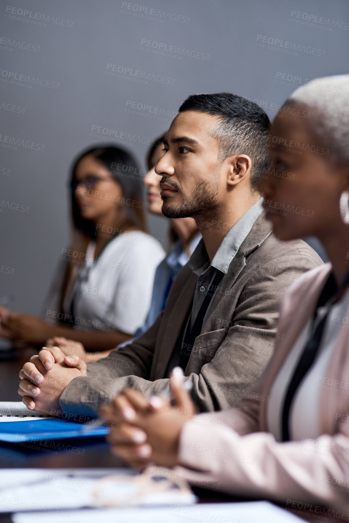 Buy stock photo Shot of a group of businesspeople attending a conference
