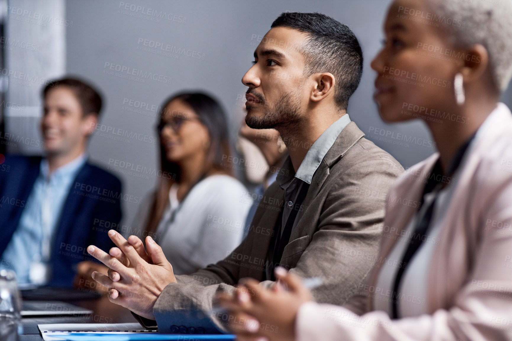 Buy stock photo Shot of a group of businesspeople having a meeting in a boardroom