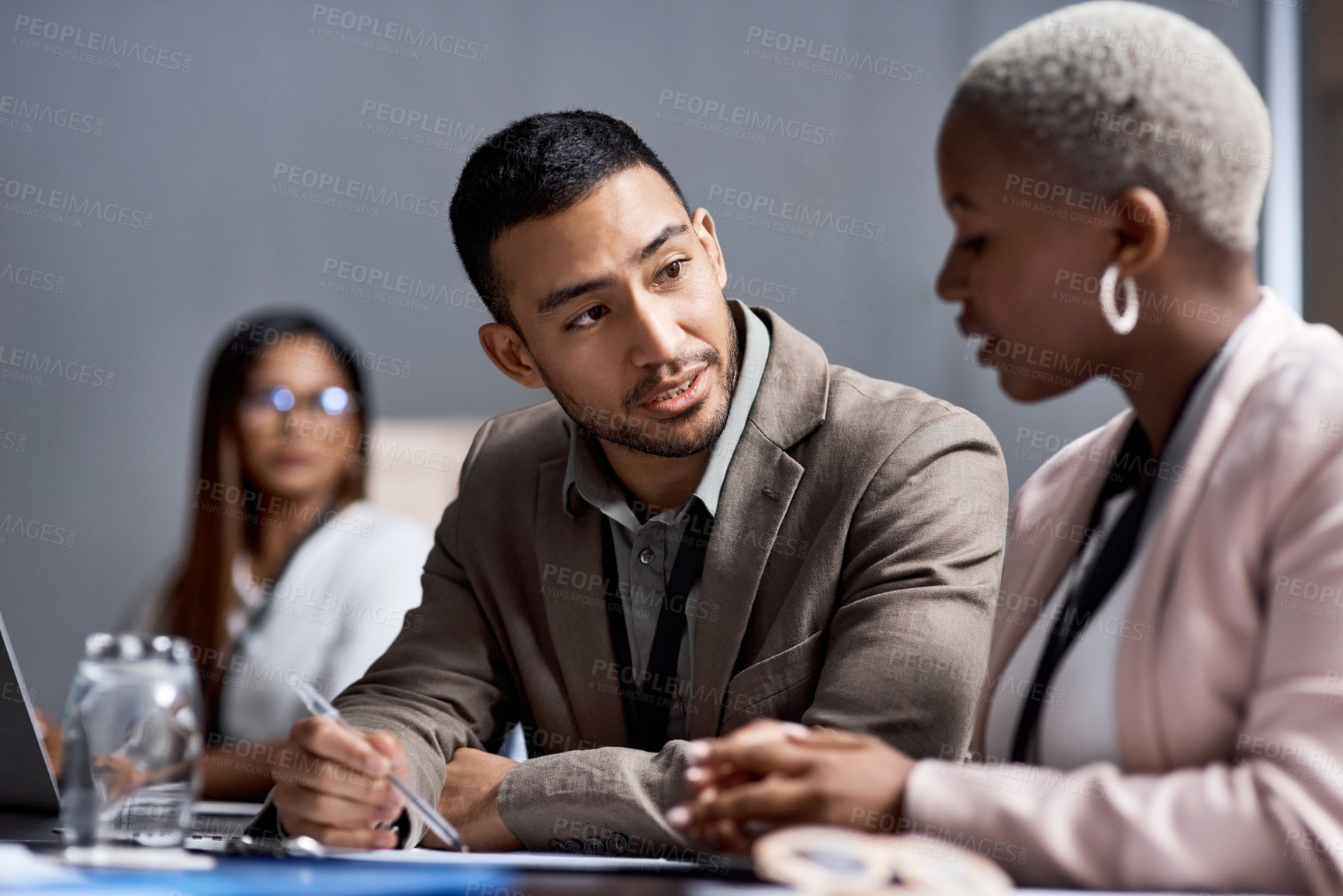 Buy stock photo Shot of a group of businesspeople having a meeting in a boardroom