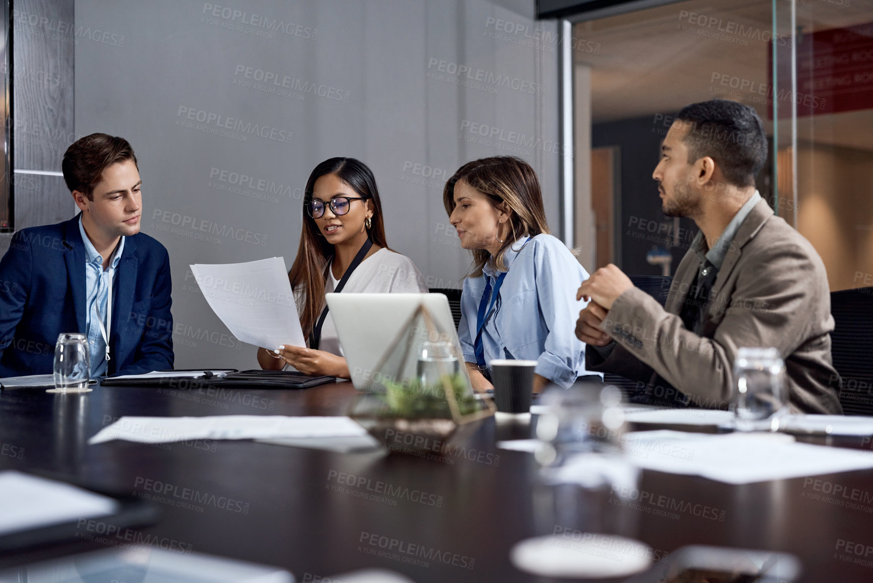 Buy stock photo Shot of a group of businesspeople having a meeting in a boardroom