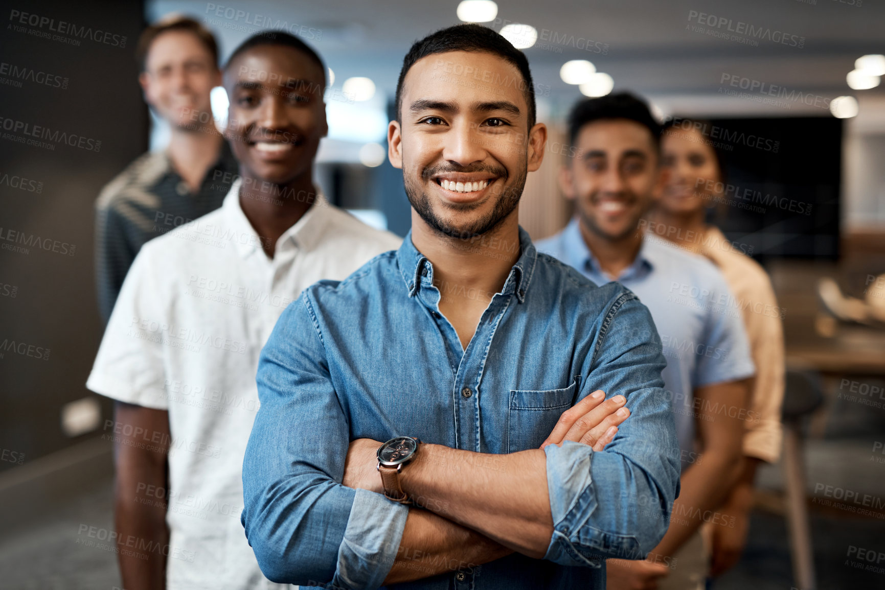 Buy stock photo Portrait of a group of confident young businesspeople working together in a modern office