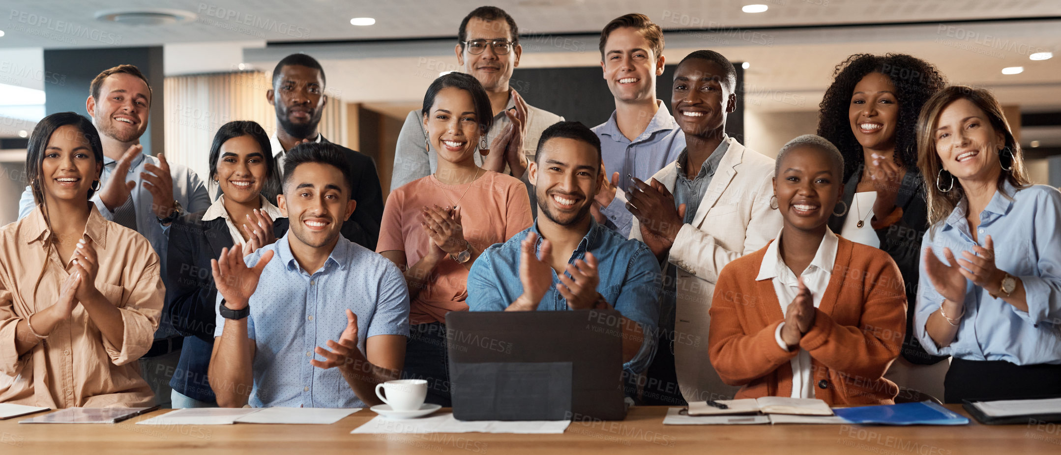 Buy stock photo Shot of a group of young businesspeople clapping during a conference in a modern office