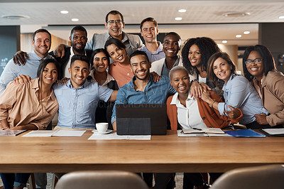 Buy stock photo Shot of a group of young businesspeople using a laptop at a conference in a modern office