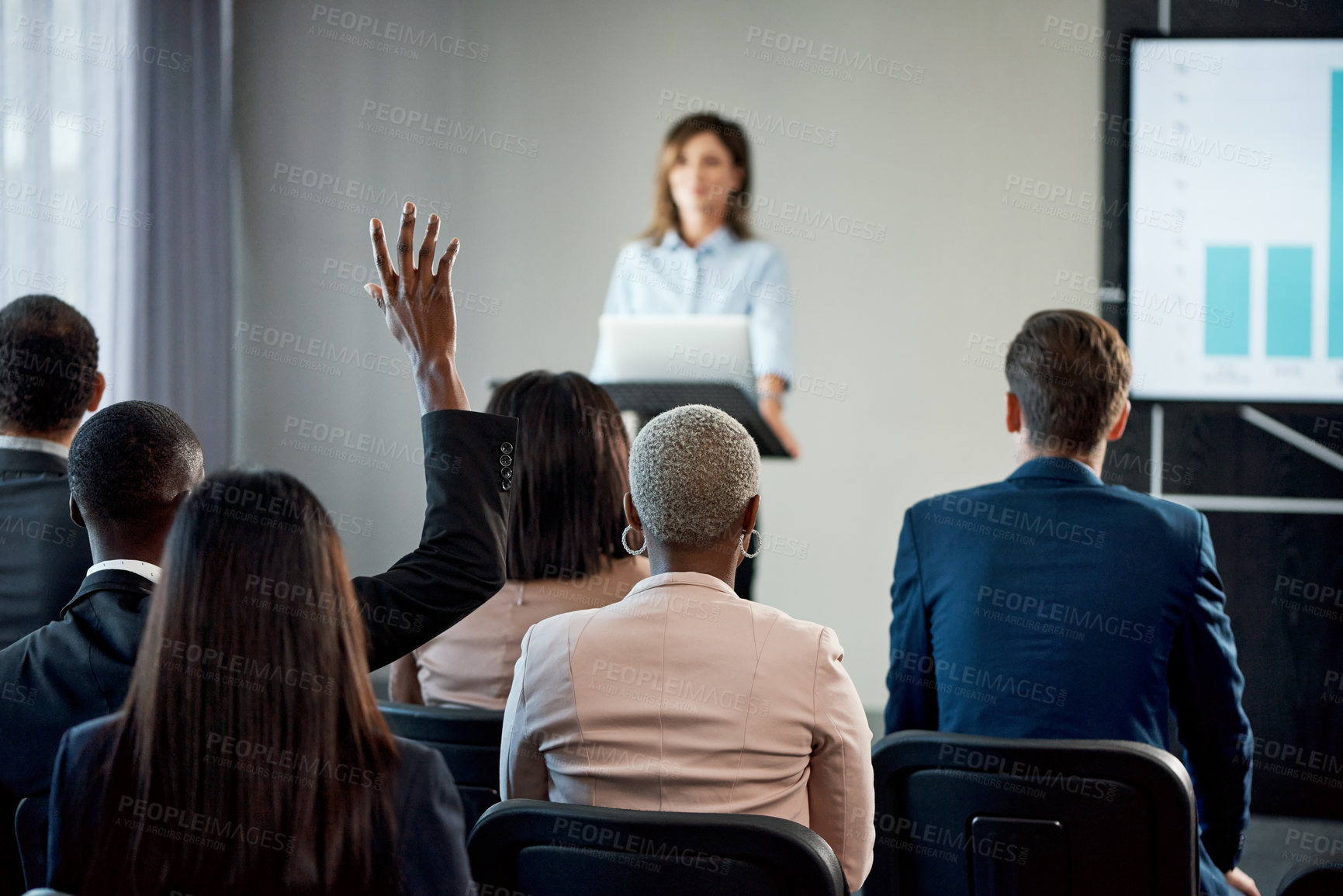Buy stock photo Rearview shot of a group of businesspeople attending a conference