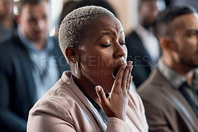Buy stock photo Shot of a an exhausted businesswoman yawning during a conference in a modern office