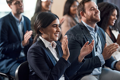 Buy stock photo Shot of a group of young businesspeople clapping during a conference in a modern office