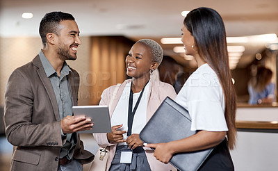 Buy stock photo Shot of a group of businesspeople using a digital tablet at a conference