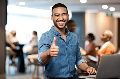 Buy stock photo Shot of a young businessman showing thumbs up while using a laptop at a conference
