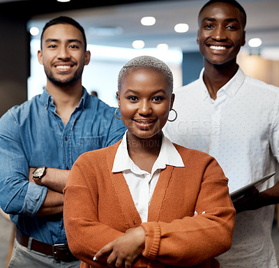 Buy stock photo Portrait of a group of confident young businesspeople working together in a modern office