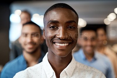 Buy stock photo Portrait of a group of confident young businesspeople working together in a modern office