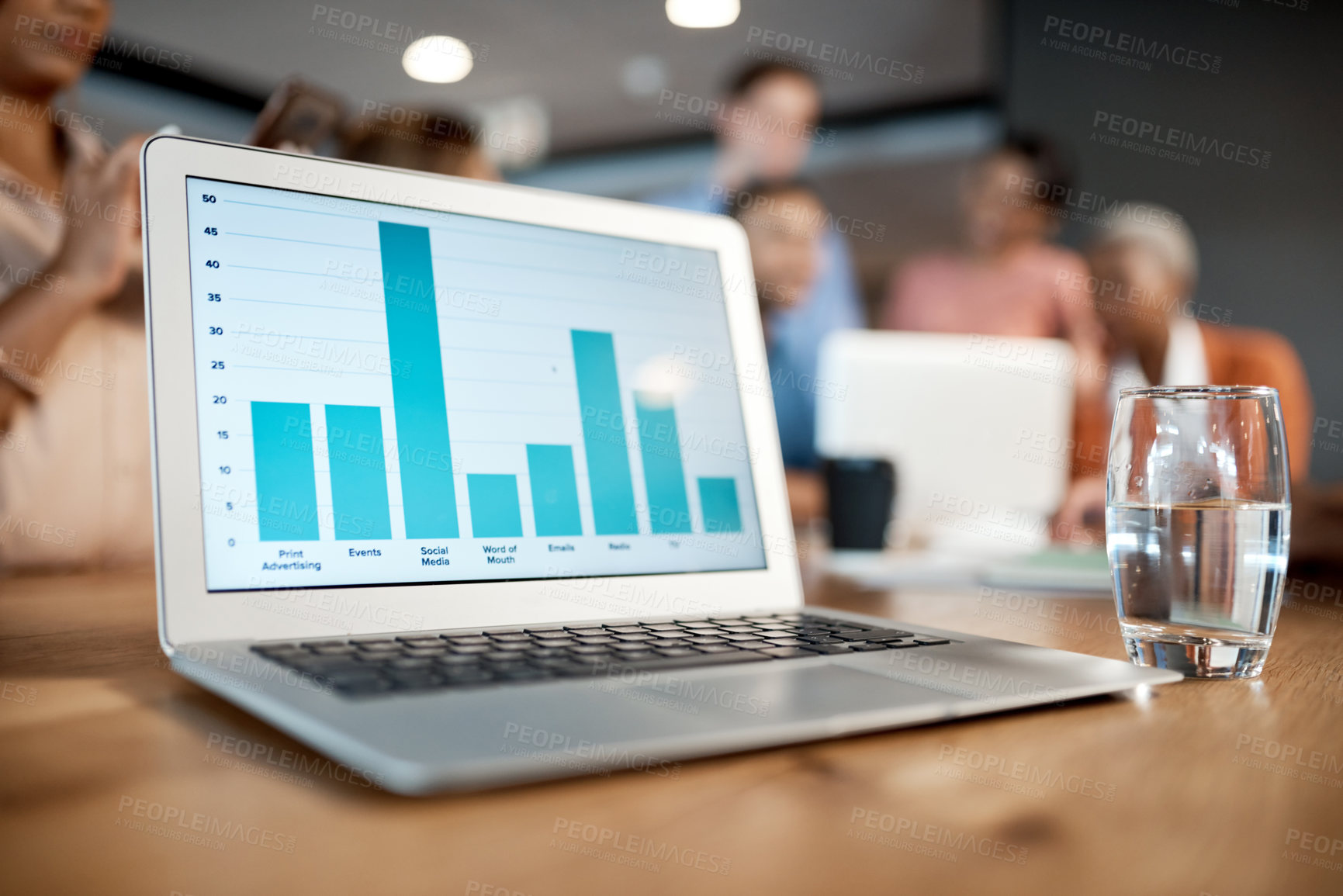 Buy stock photo Shot of a laptop with graphs on it at a conference in a modern office