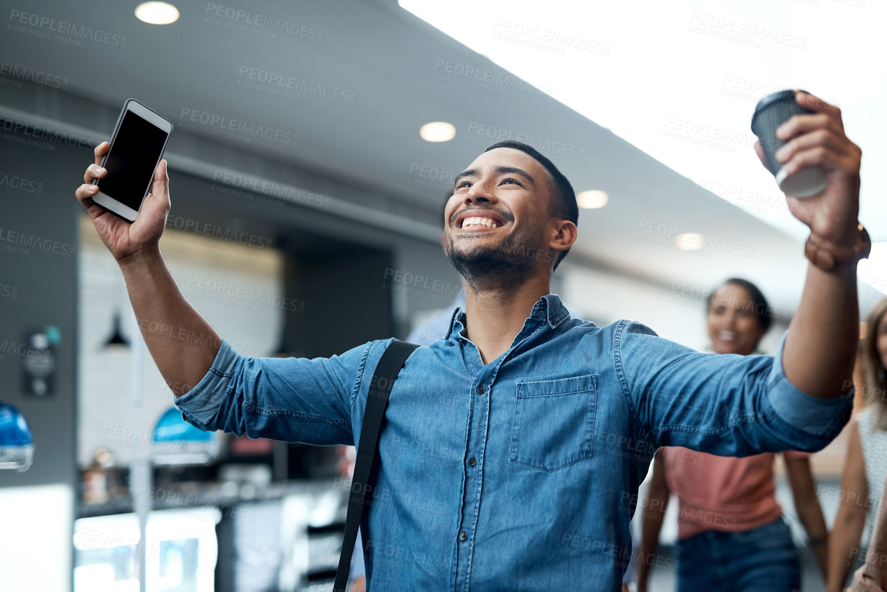 Buy stock photo Shot of a young businessman celebrating during a conference in a modern office