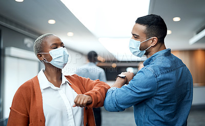 Buy stock photo Shot of a masked young businessman and businesswoman greeting each other with an elbow bump at a conference