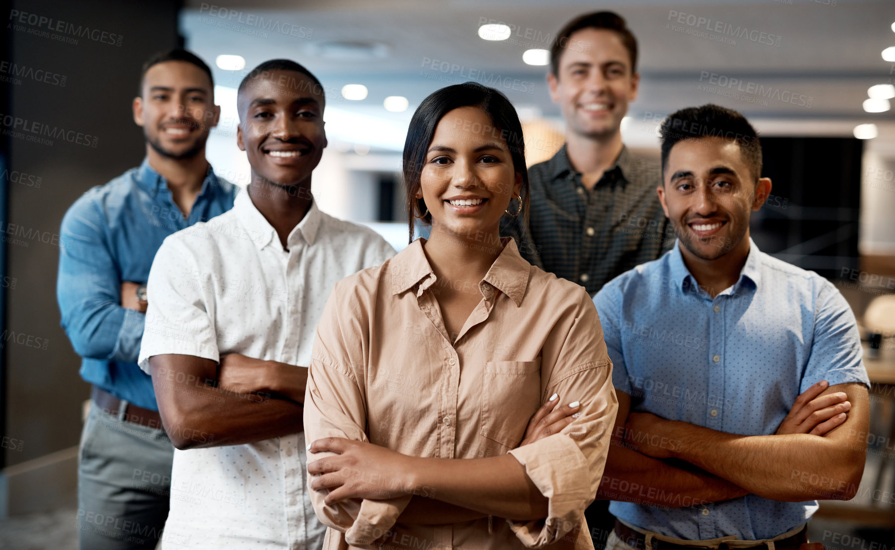 Buy stock photo Portrait of a group of confident young businesspeople working together in a modern office