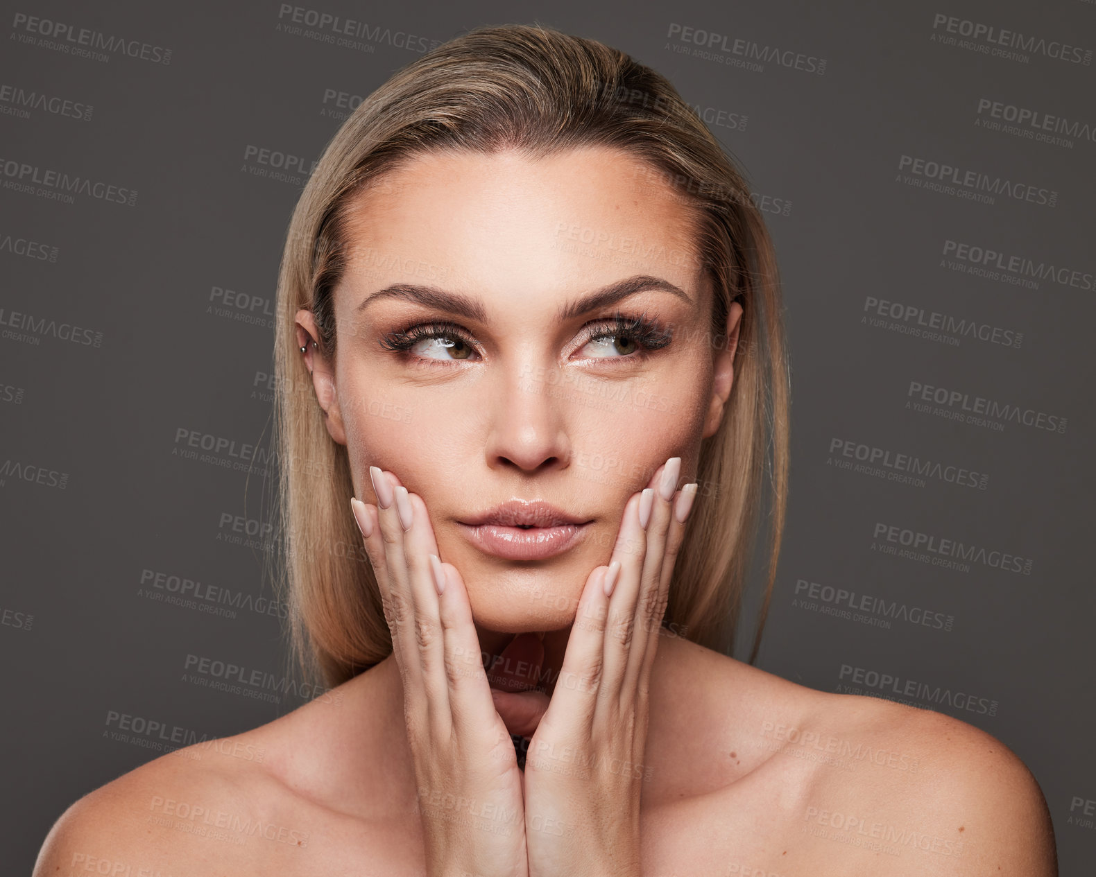 Buy stock photo Woman, beauty and touch with skin in studio for natural makeup, thinking and wellness on gray background. Girl, reflection and dermatology with cosmetics, results and change with transformation