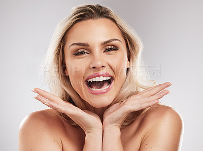 Buy stock photo Studio shot of a beautiful young woman standing against a grey background