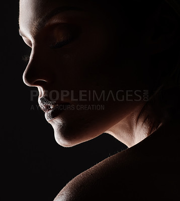 Buy stock photo Studio shot of a woman woman posing against a black background