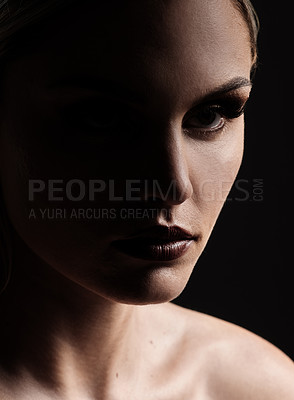 Buy stock photo Studio shot of a woman woman posing against a black background