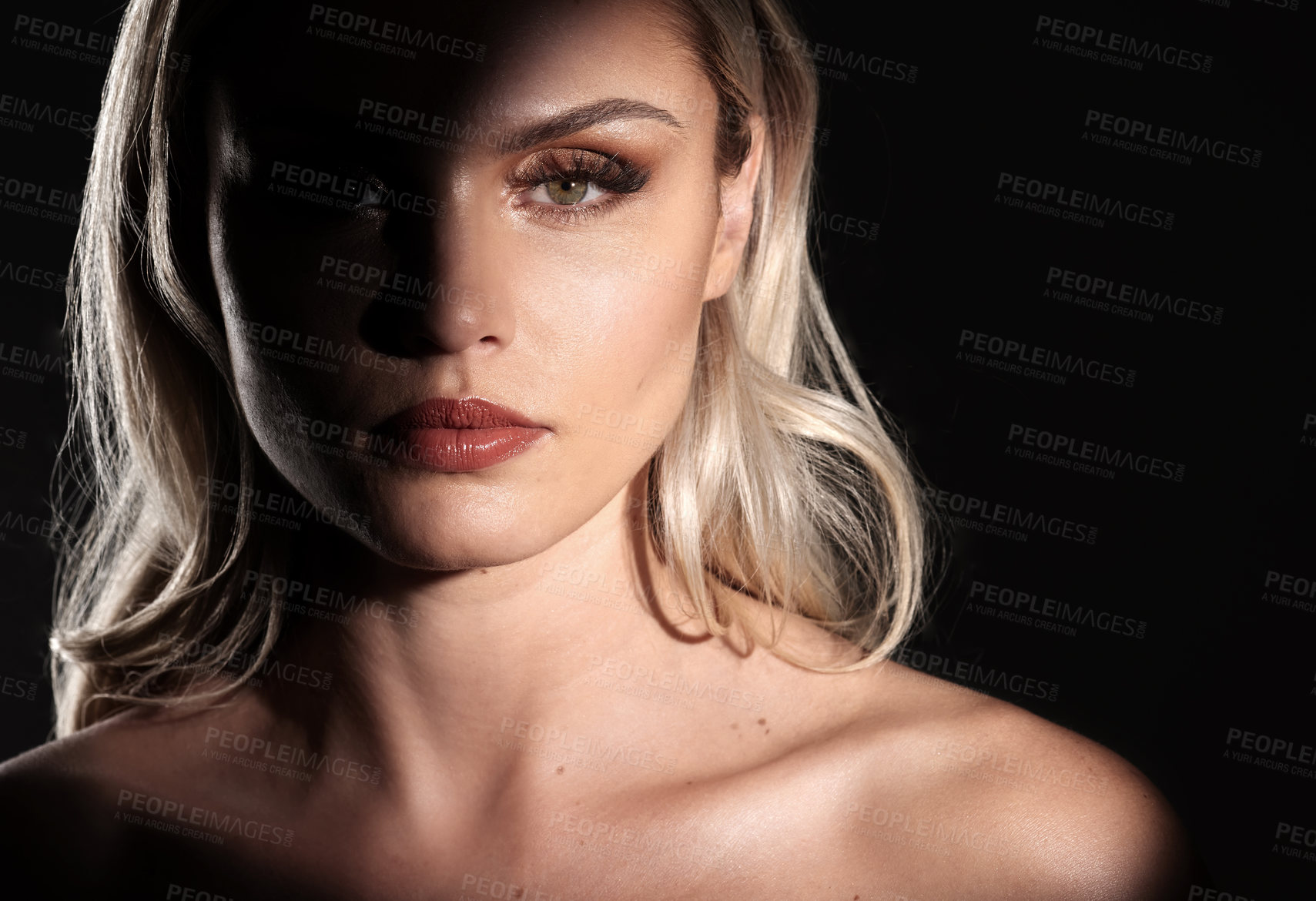 Buy stock photo Studio shot of a woman woman posing against a black background