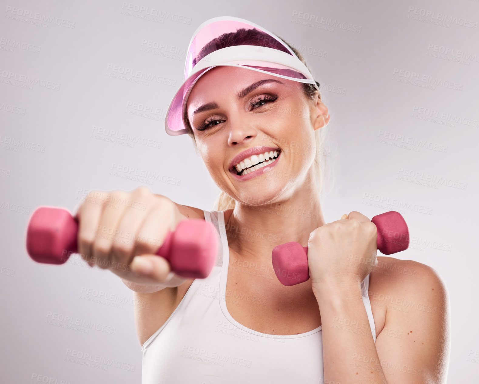 Buy stock photo Studio shot of a sporty young woman posing against a grey background