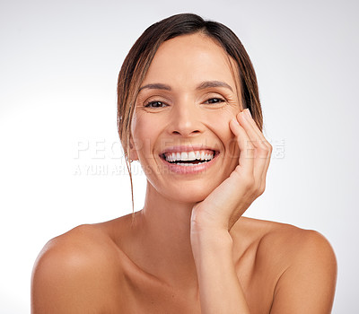 Buy stock photo Shot of an attractive young woman posing alone in the studio