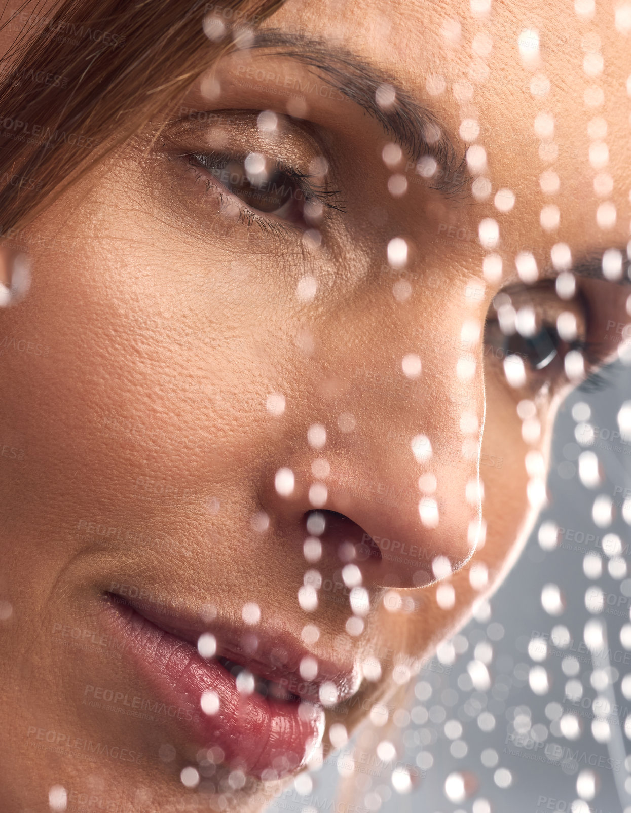 Buy stock photo Studio shot of a beautiful young woman taking a shower against a grey background