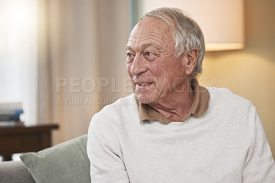 Buy stock photo Shot of an elderly man sitting on the couch at home
