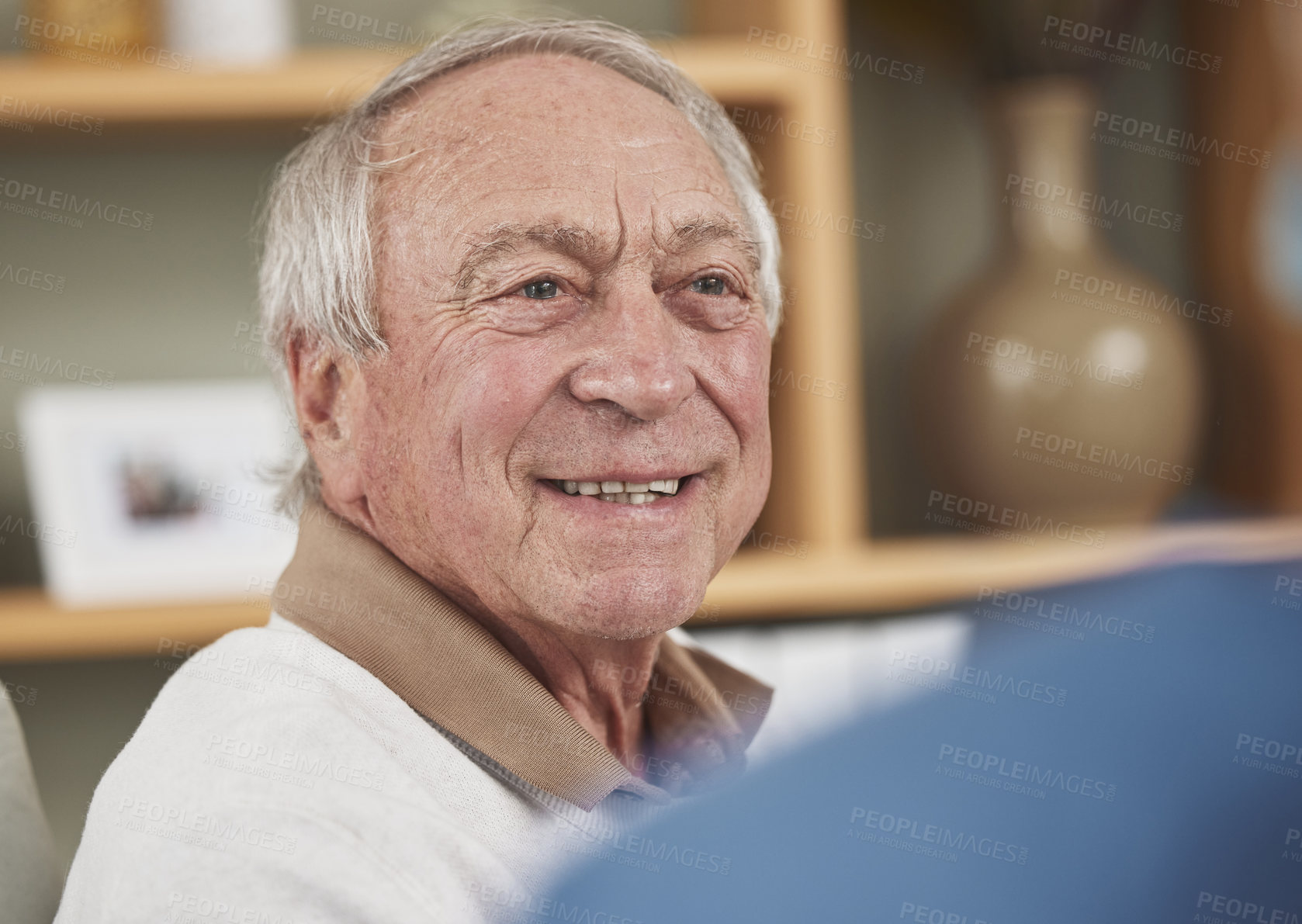 Buy stock photo Smile, senior man and conversation in nursing home for help, support or medical rehabilitation. Retirement, care house and face of elderly patient in living room for healthcare, recovery or wellness