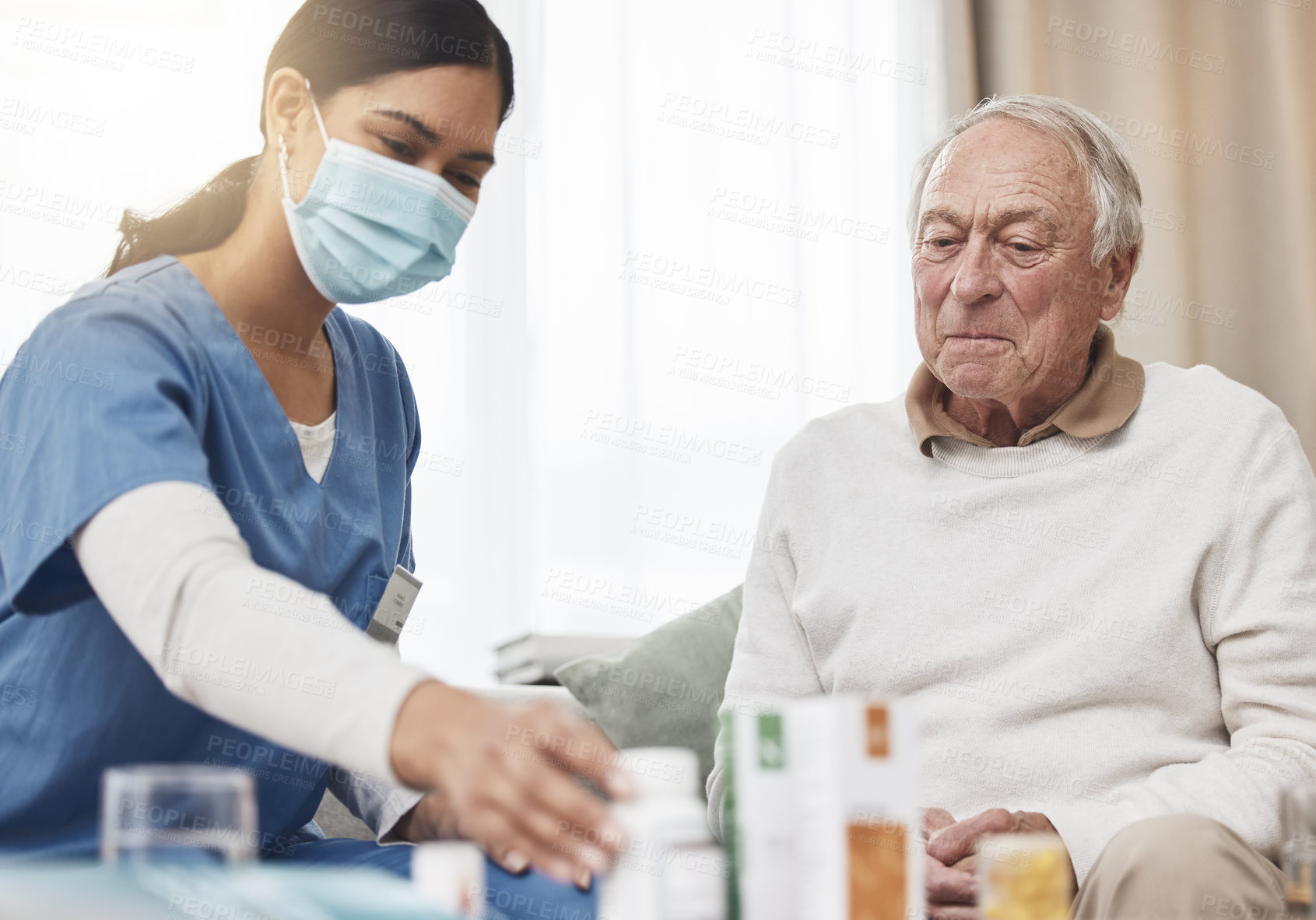 Buy stock photo Nurse, senior man and help with medication in home for healthcare, support and trust. Caregiver, patient and commitment for medical service with treatment or pills for illness, sickness and health
