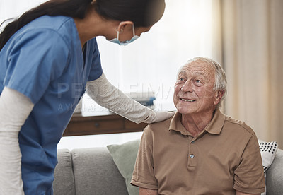 Buy stock photo Shot of a young female nurse having a checkup with an elderly patient at home