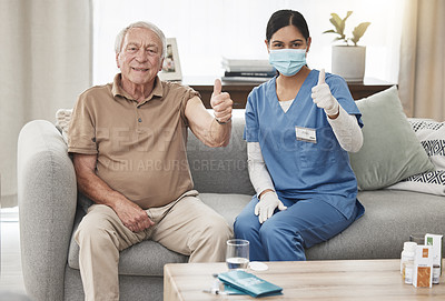 Buy stock photo Shot of an elderly man and a female nurse showing a thumbs up during a checkup at home