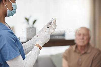 Buy stock photo Shot of a young nurse giving an elderly man the vaccine at home